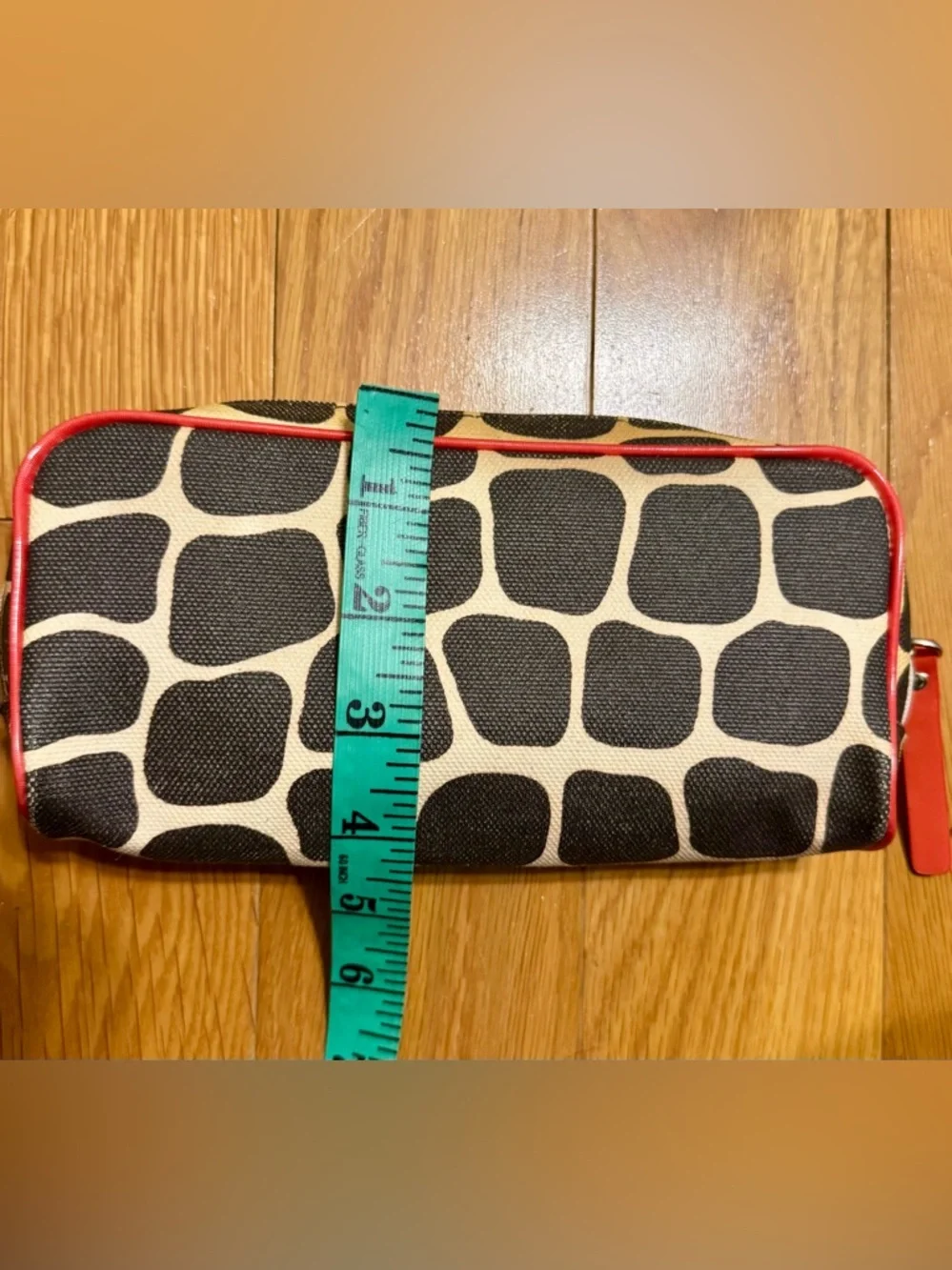 Kate Spade New York cosmetic bag or pencil case featuring a signature giraffe-